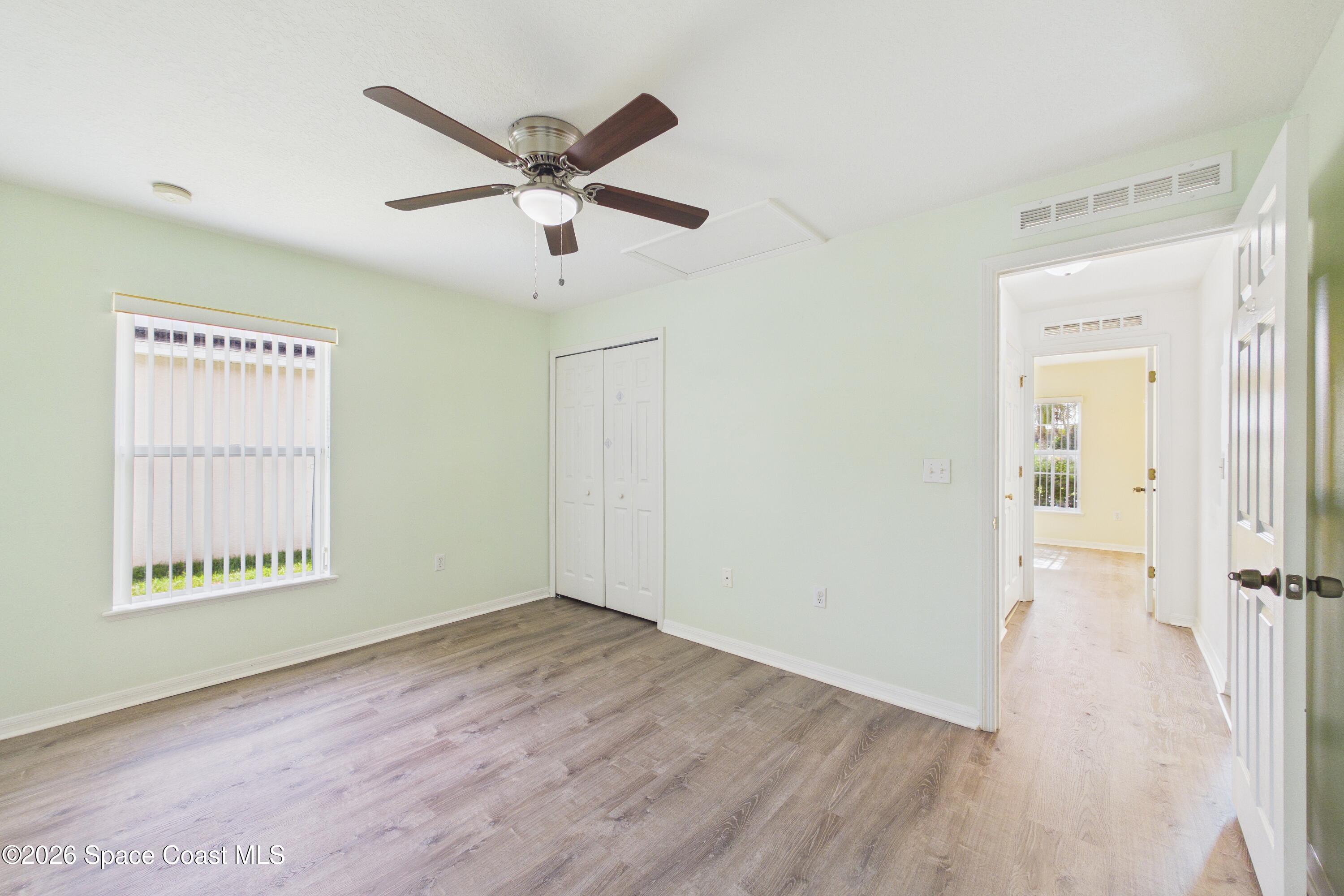 183 Stony Point Drive Sebastian, FL 32958 - Photo 15 of 27 a view of a ceiling fan and wooden floor in a room