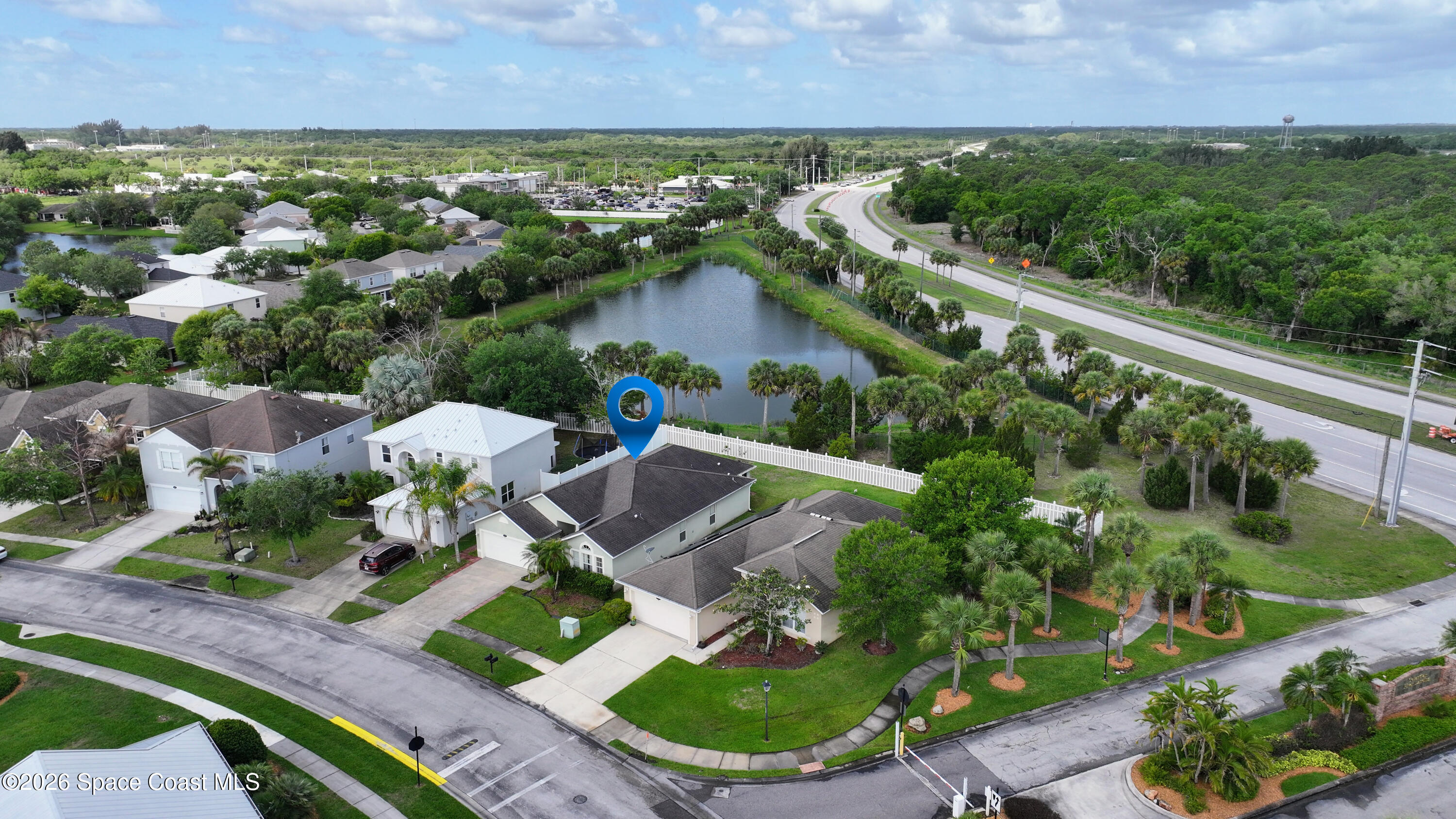 183 Stony Point Drive Sebastian, FL 32958 - Photo 21 of 27 an aerial view of a house with a garden and lake view