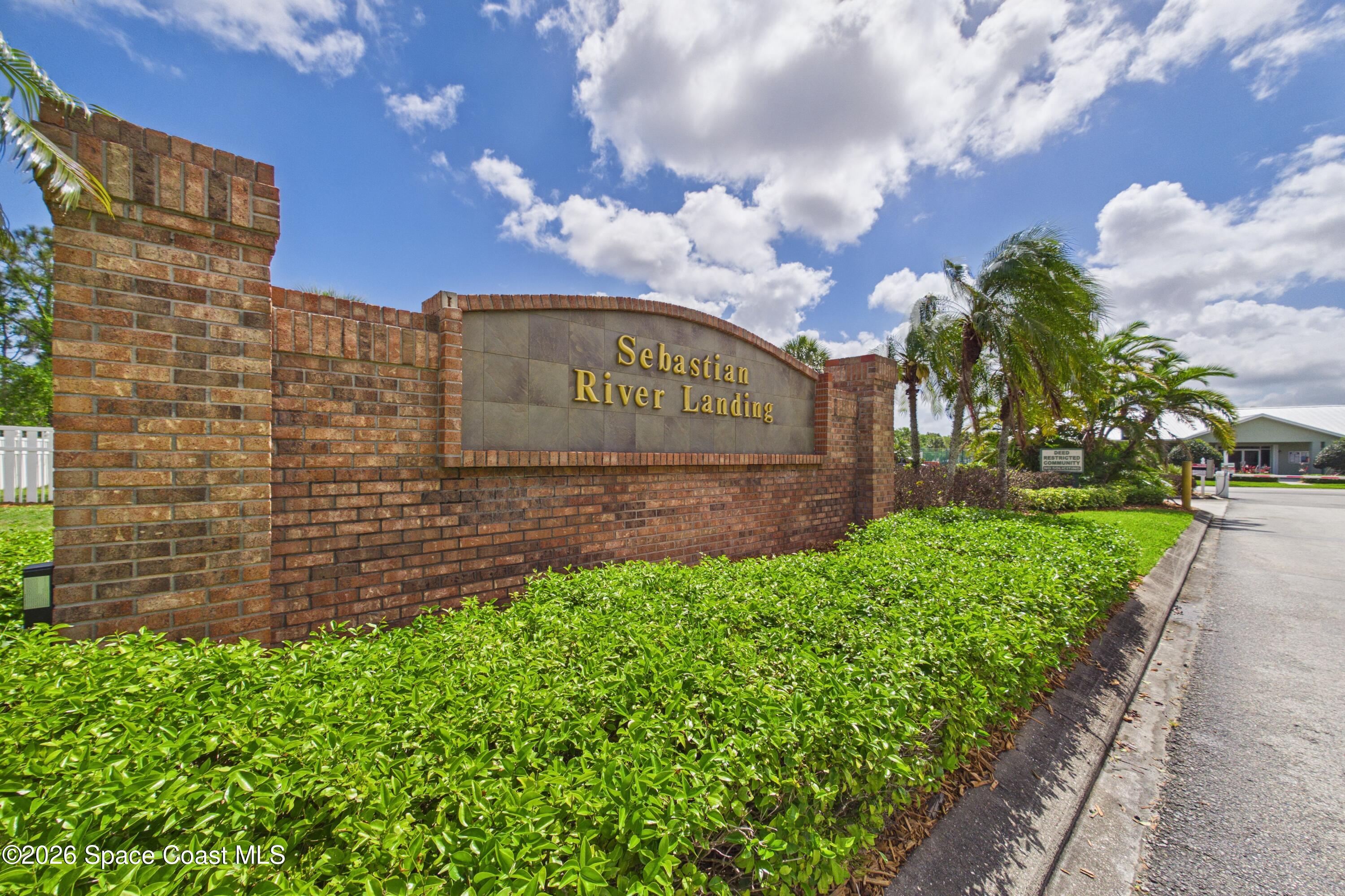 183 Stony Point Drive Sebastian, FL 32958 - Photo 27 of 27 a view of a building with a garden