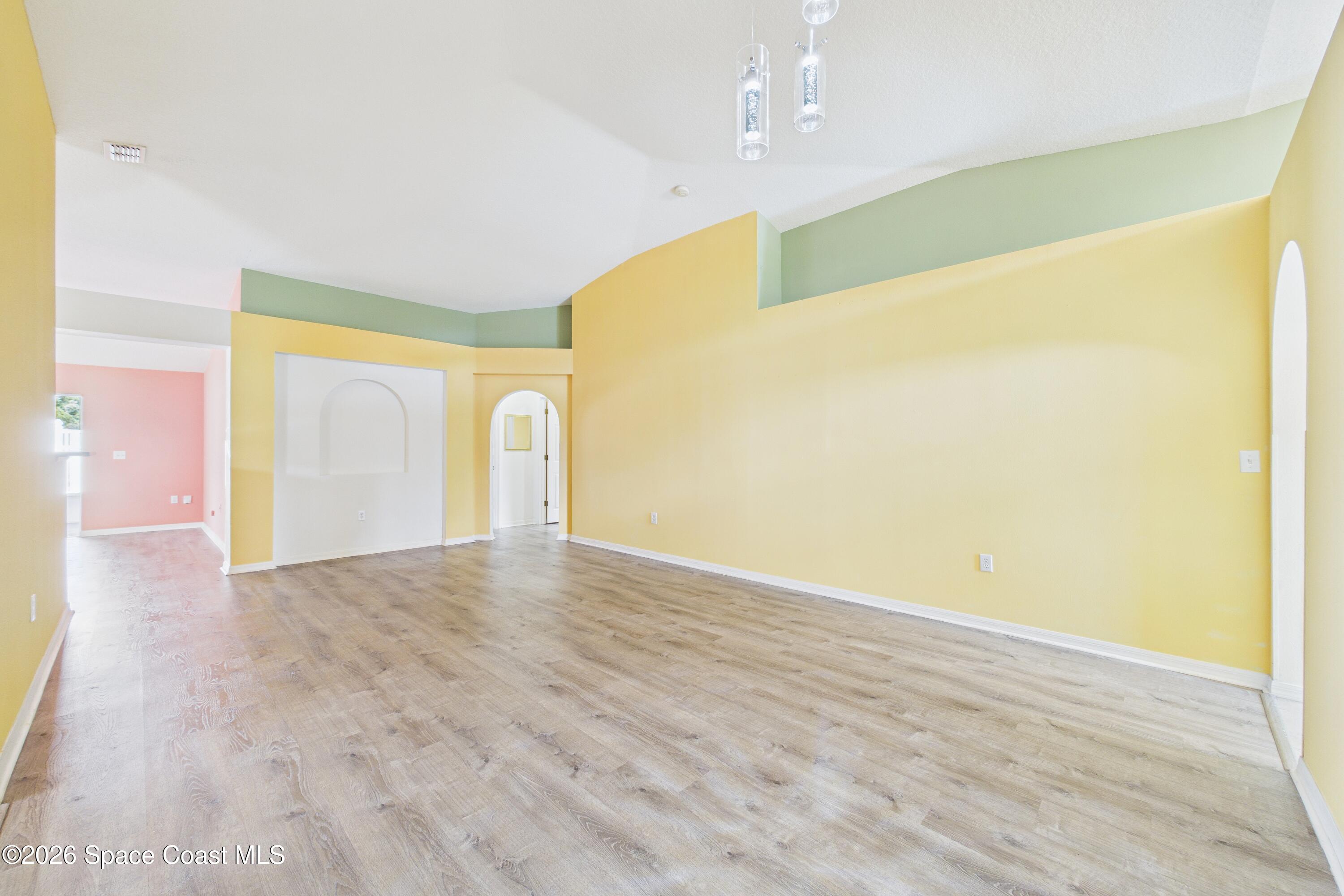 183 Stony Point Drive Sebastian, FL 32958 - Photo 3 of 27 a view of empty room with wooden floor