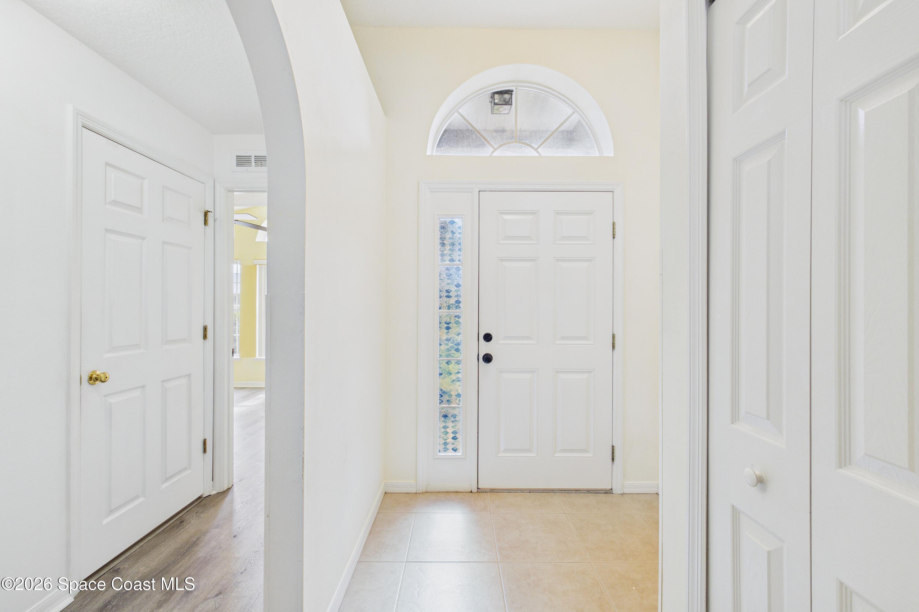 183 Stony Point Drive Sebastian, FL 32958 - Photo 5 of 27 a view of a hallway with wooden floor