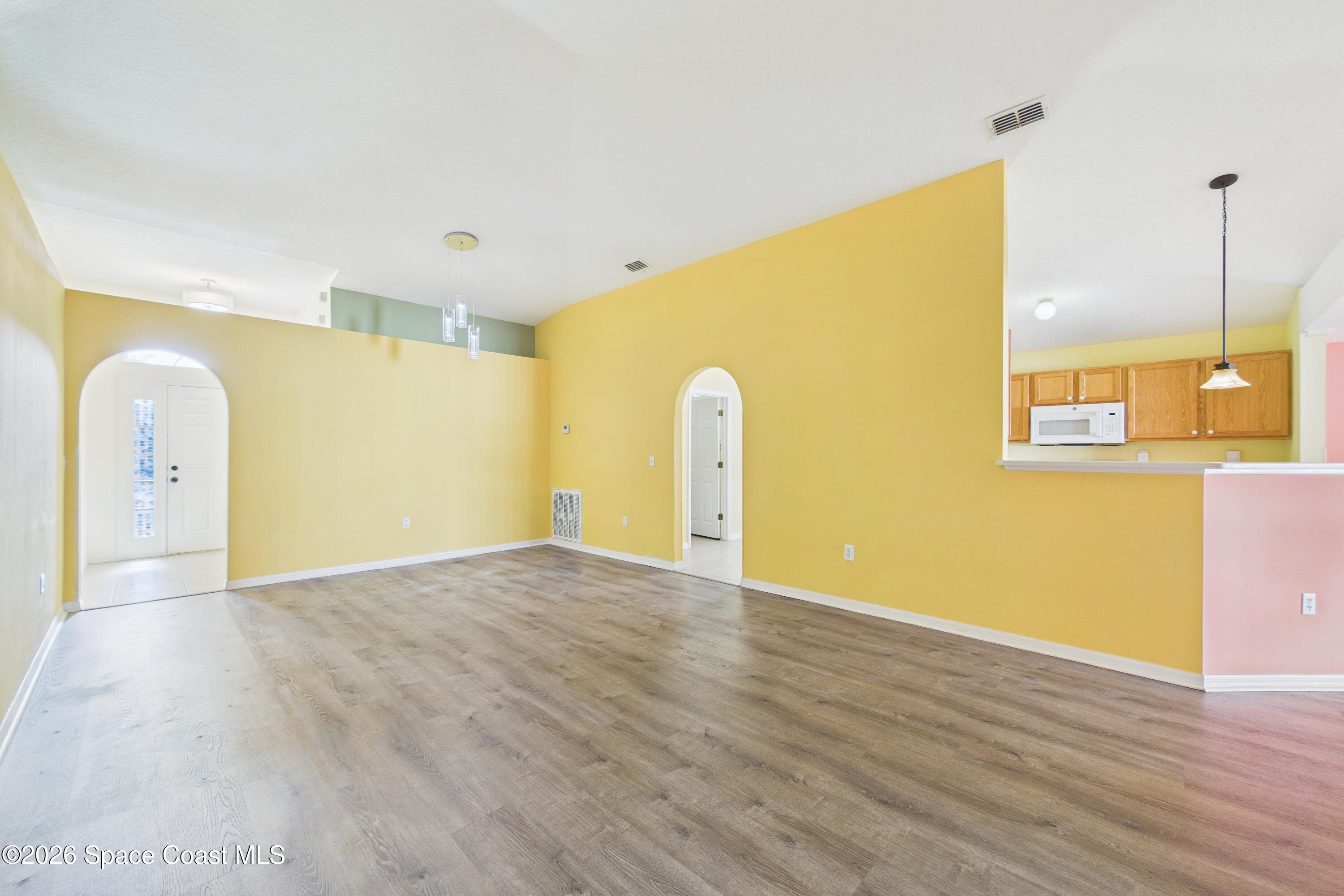 183 Stony Point Drive Sebastian, FL 32958 - Photo 6 of 27 a view of a livingroom with wooden floor
