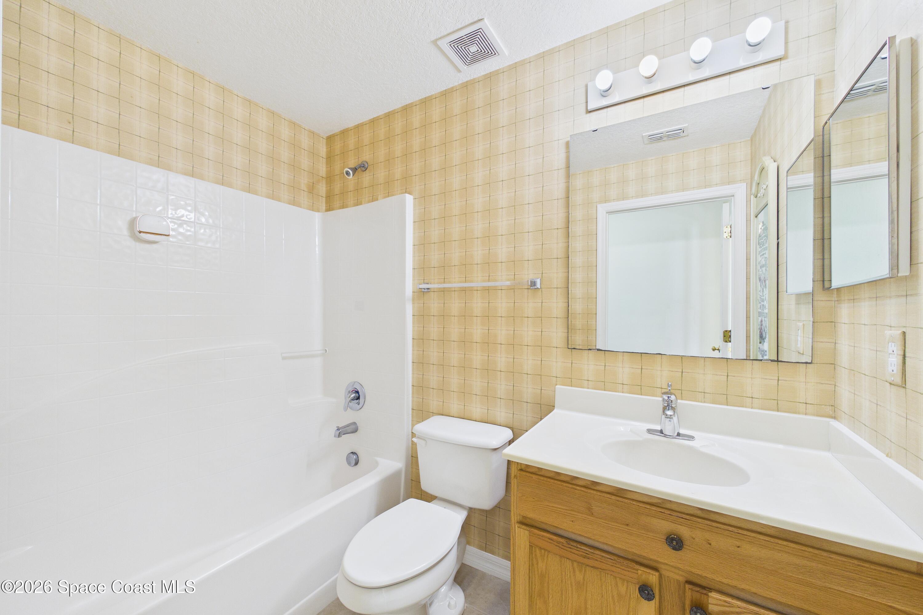 183 Stony Point Drive Sebastian, FL 32958 - Photo 10 of 27 a bathroom with a sink a toilet and shower