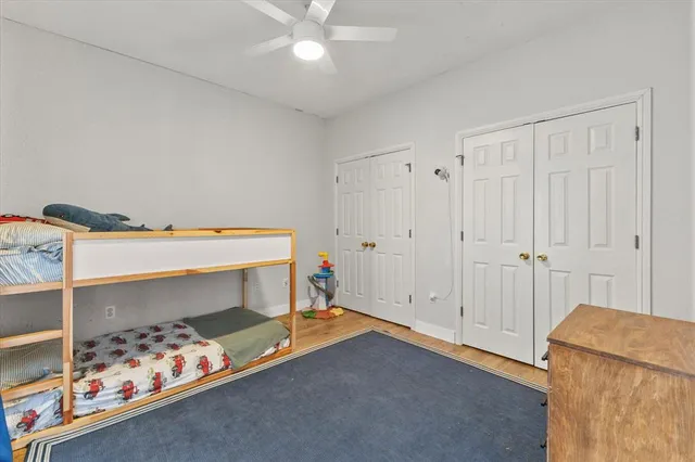 a bed room with a bed and a baby crib