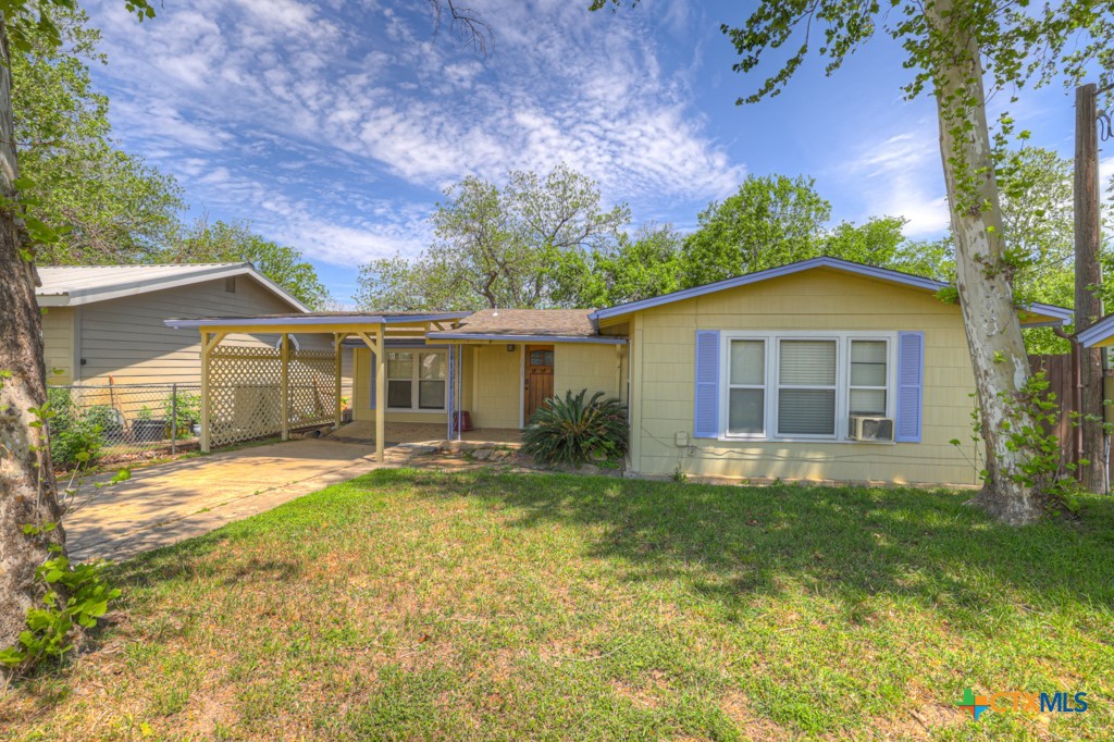 1015 Reiley Road Seguin, TX 78155 - Photo 3 of 45 a front view of a house with a yard and garage