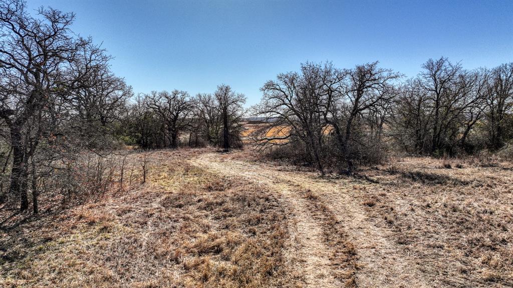 2048 Farm To Market 2048 Boyd, TX 76023 - Photo 20 of 21 a view of a yard covered with snow in the background