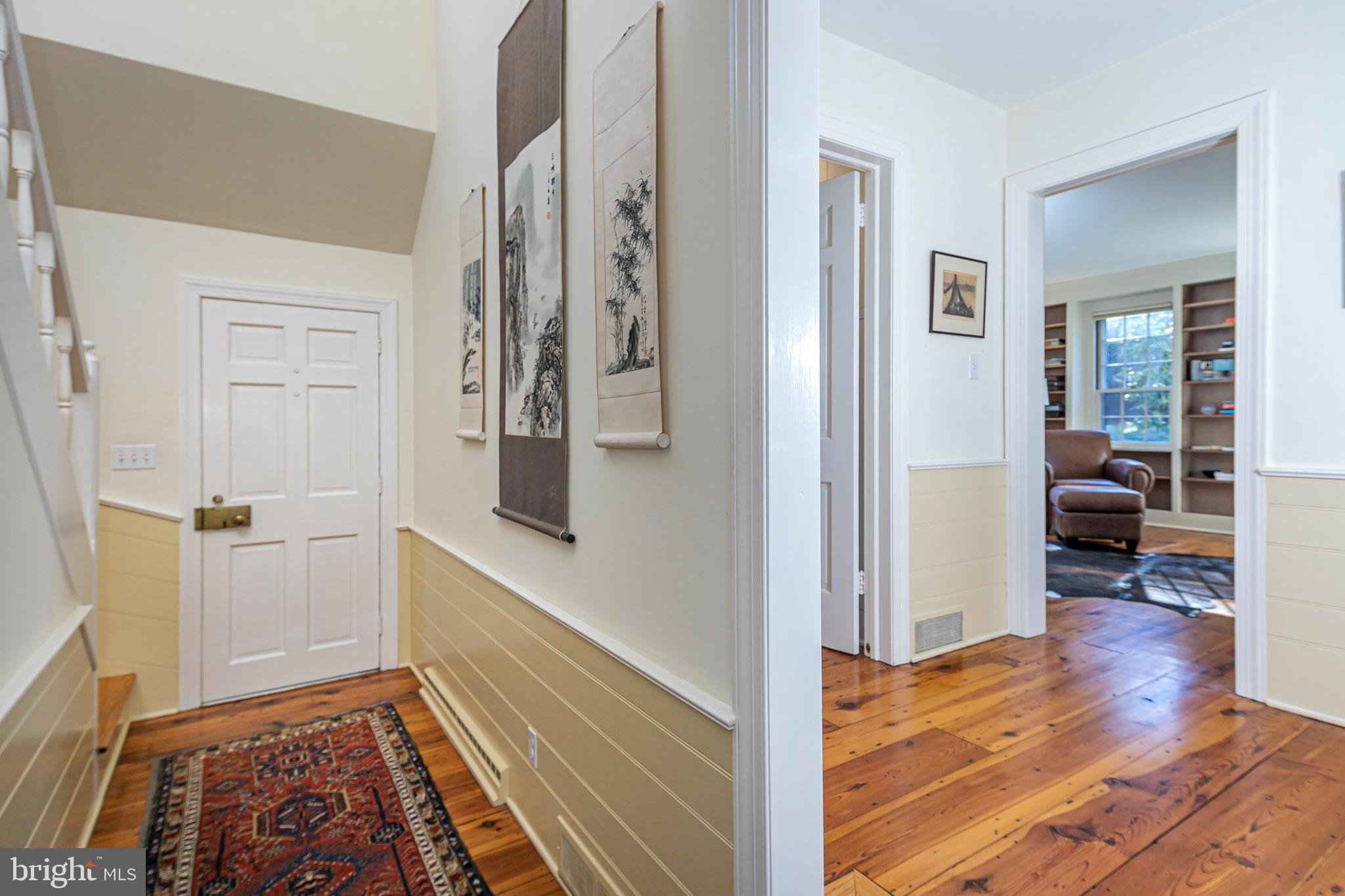 115 Arreton Road Princeton, NJ 08540 - Photo 5 of 35 a view of a hallway with wooden floor and furniture