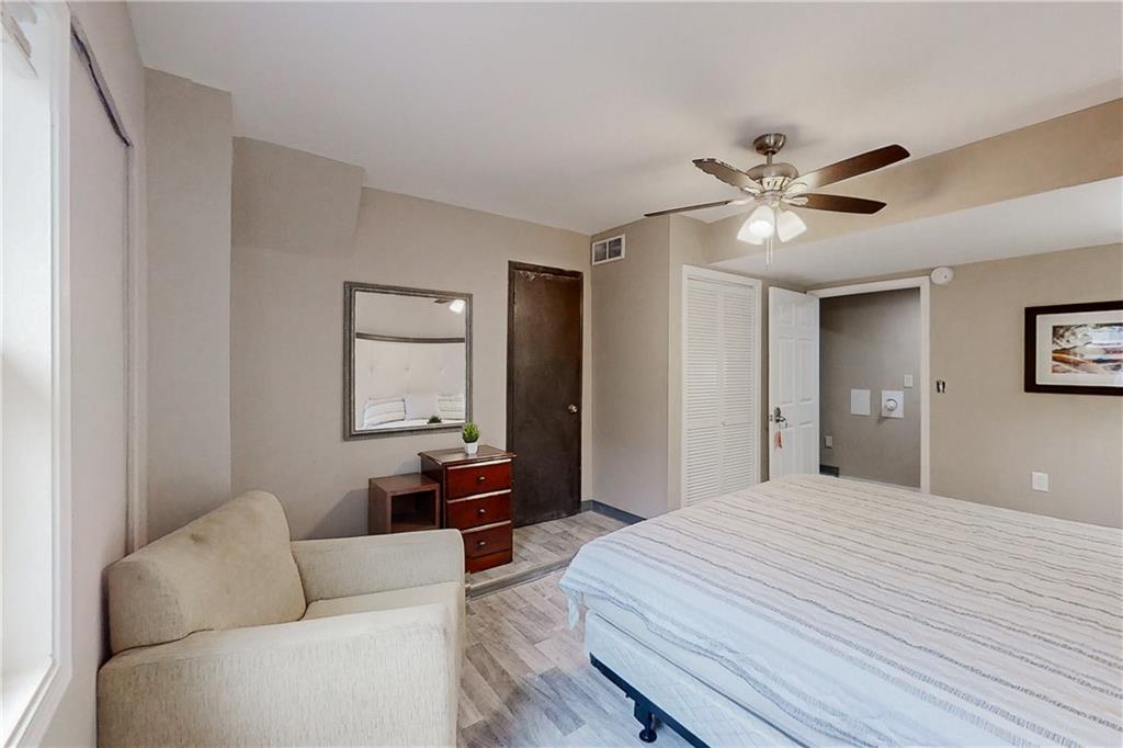 2284 Emerald Springs Drive Decatur, GA 30035 - Photo 26 of 30 a bedroom with a large bed couch and a window