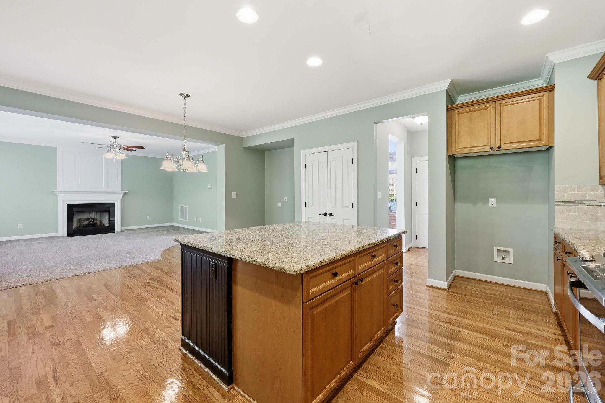 3308 Grandeur Road Charlotte, NC 28269 - Photo 15 of 45 a kitchen with granite countertop a stove and a sink