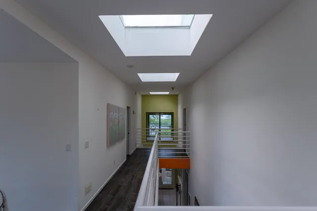 a view of a balcony with a wooden fence