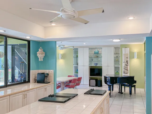 a bedroom with a large bed and a large window