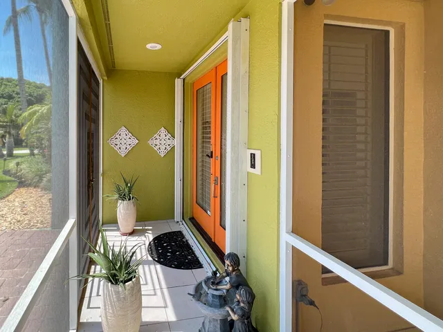 an aerial view of a house with a yard and garden