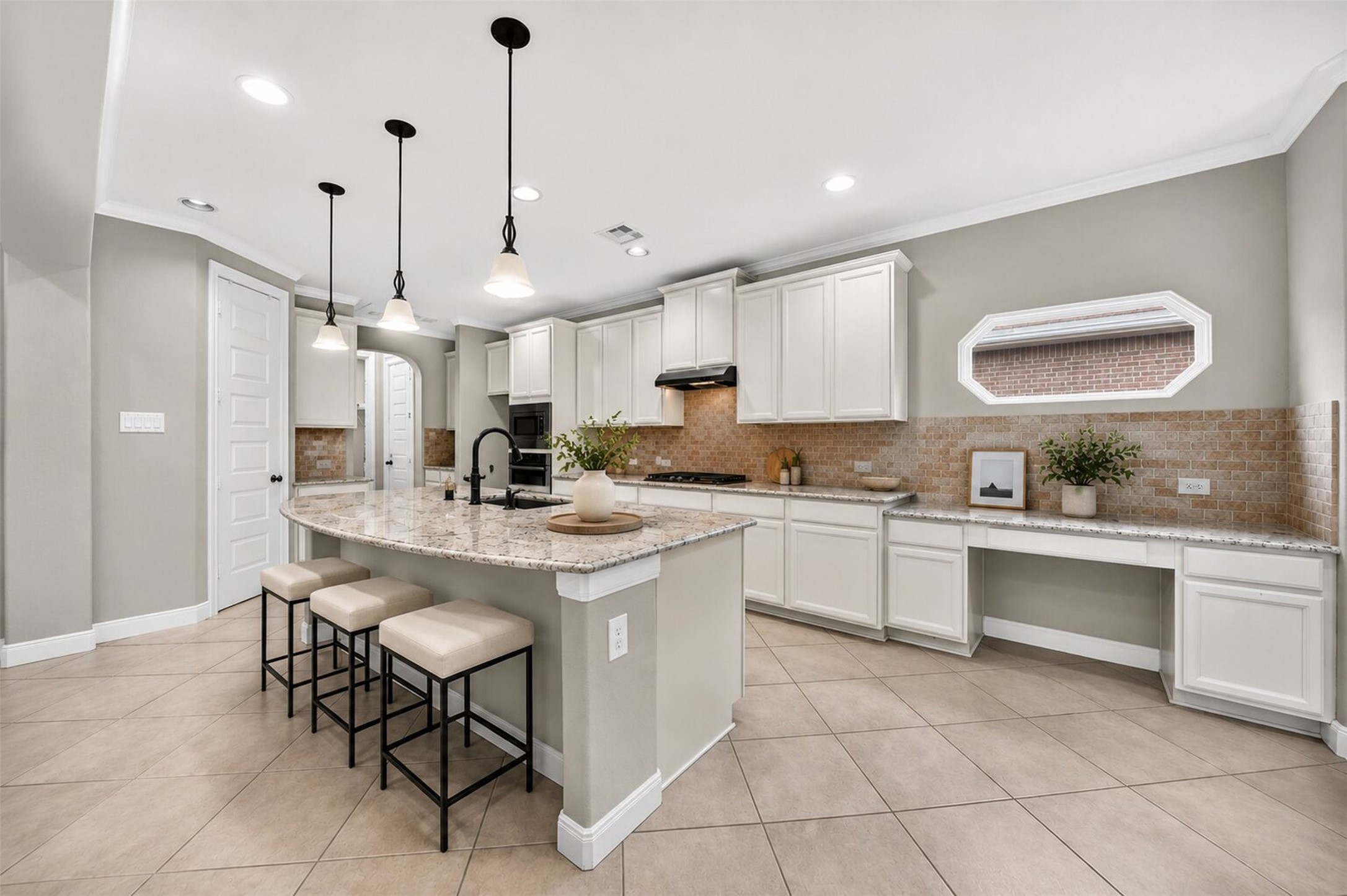 6234 Avon Landing Lane Spring, TX 77379 - Photo 15 of 49 The massive central island offers beautiful pendant lighting, with counter seating and is the perfect place for casual breakfasts, lunches or when entertaining guests. Virtually staged for ideas.