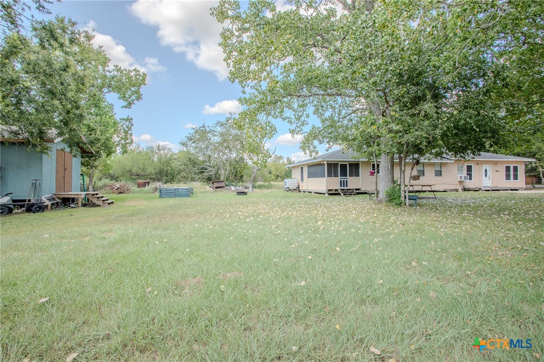705 West Ash Street Edna, TX 77957 - Photo 17 of 19 a front view of house with yard and trees