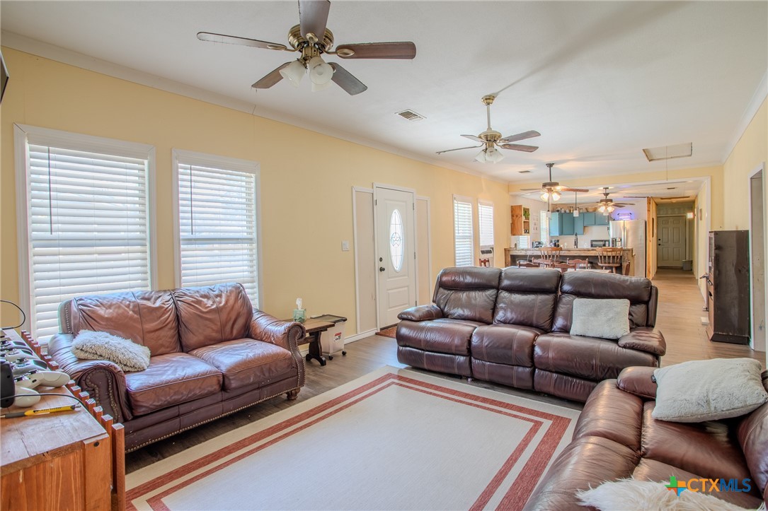 705 West Ash Street Edna, TX 77957 - Photo 5 of 19 a living room with furniture and a large window