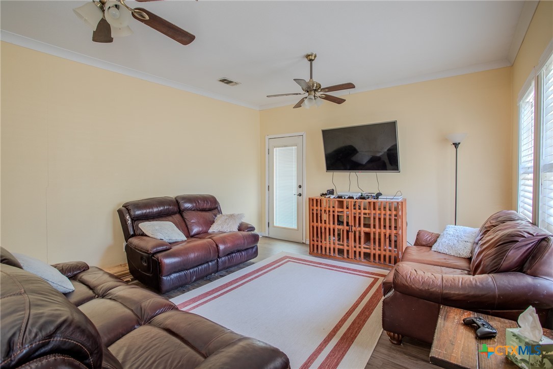 705 West Ash Street Edna, TX 77957 - Photo 6 of 19 a living room with furniture and a flat screen tv