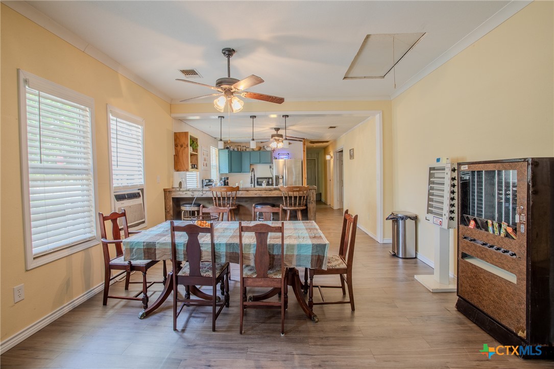 705 West Ash Street Edna, TX 77957 - Photo 7 of 19 a view of a dining room with furniture and chandelier