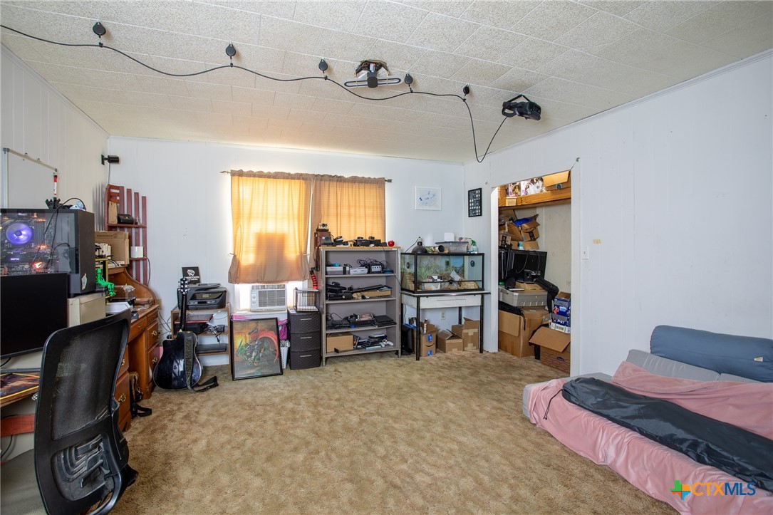 705 West Ash Street Edna, TX 77957 - Photo 10 of 19 a view of a workspace with furniture