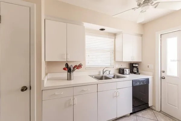 a kitchen with a sink and cabinets
