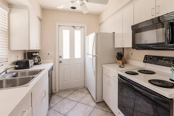 a kitchen with a stove microwave and refrigerator