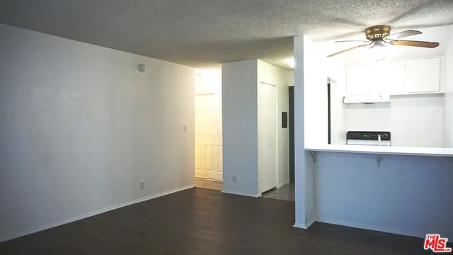 a view of a kitchen with a sink and a window