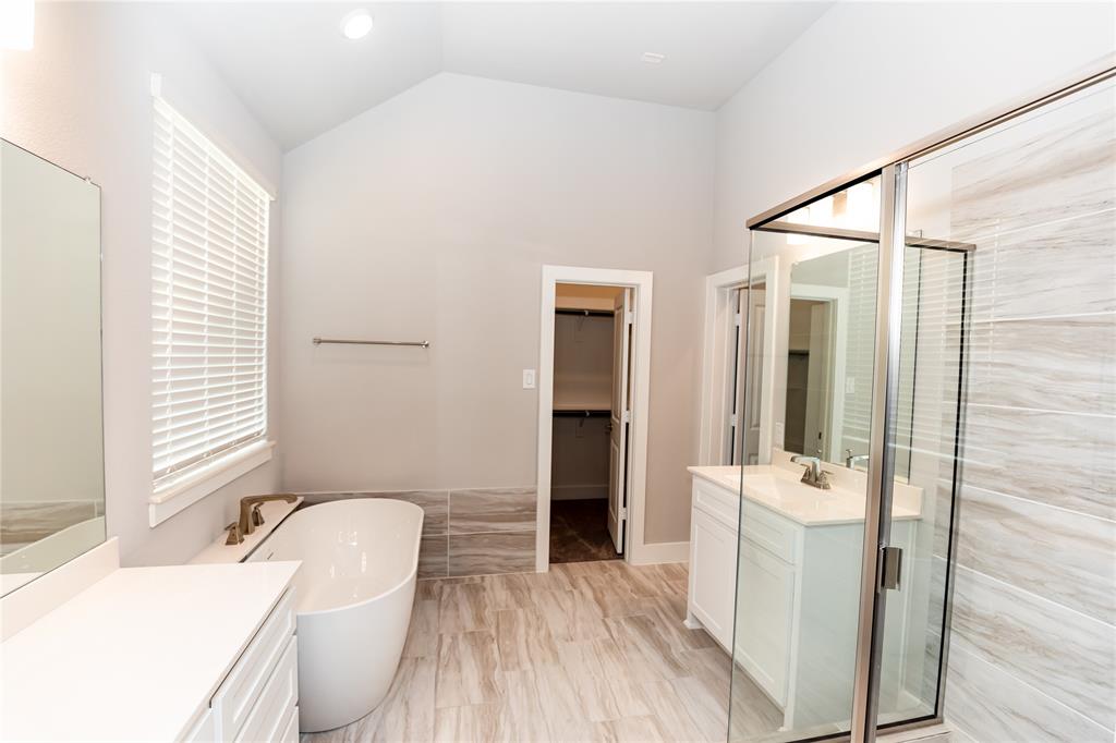 6124 Shasta Creek Road Celina, TX 75009 - Photo 10 of 27 a bathroom with a sink a toilet a tub and shower