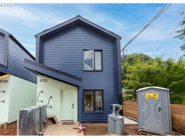 a front view of a house with parking area