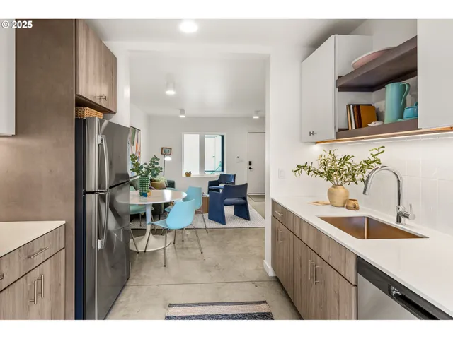a kitchen with sink and cabinets