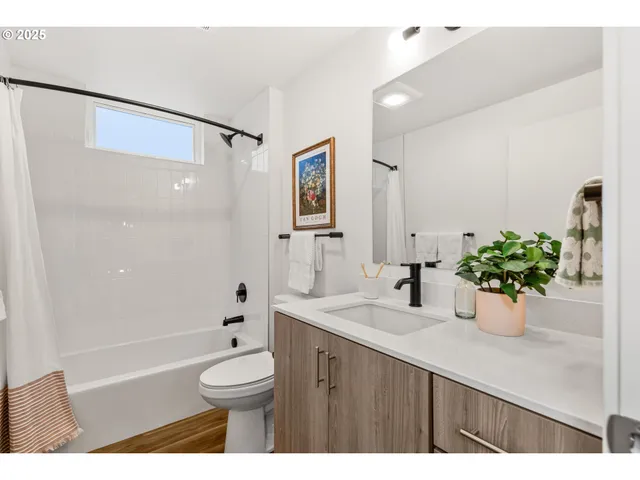 a bathroom with a sink vanity granite and a mirror