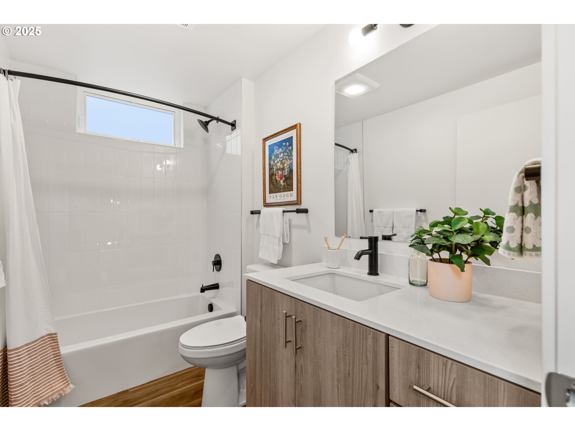 3732 Southeast Harvey Street, Unit 2 Milwaukie, OR 97222 - Photo 13 of 32 a bathroom with a sink a toilet and a large mirror
