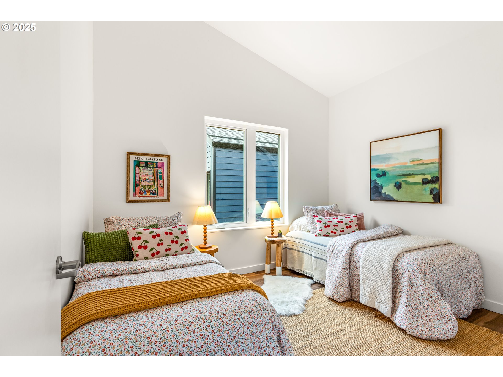 3732 Southeast Harvey Street, Unit 2 Milwaukie, OR 97222 - Photo 20 of 32 a bedroom with a bed and a painting on the wall