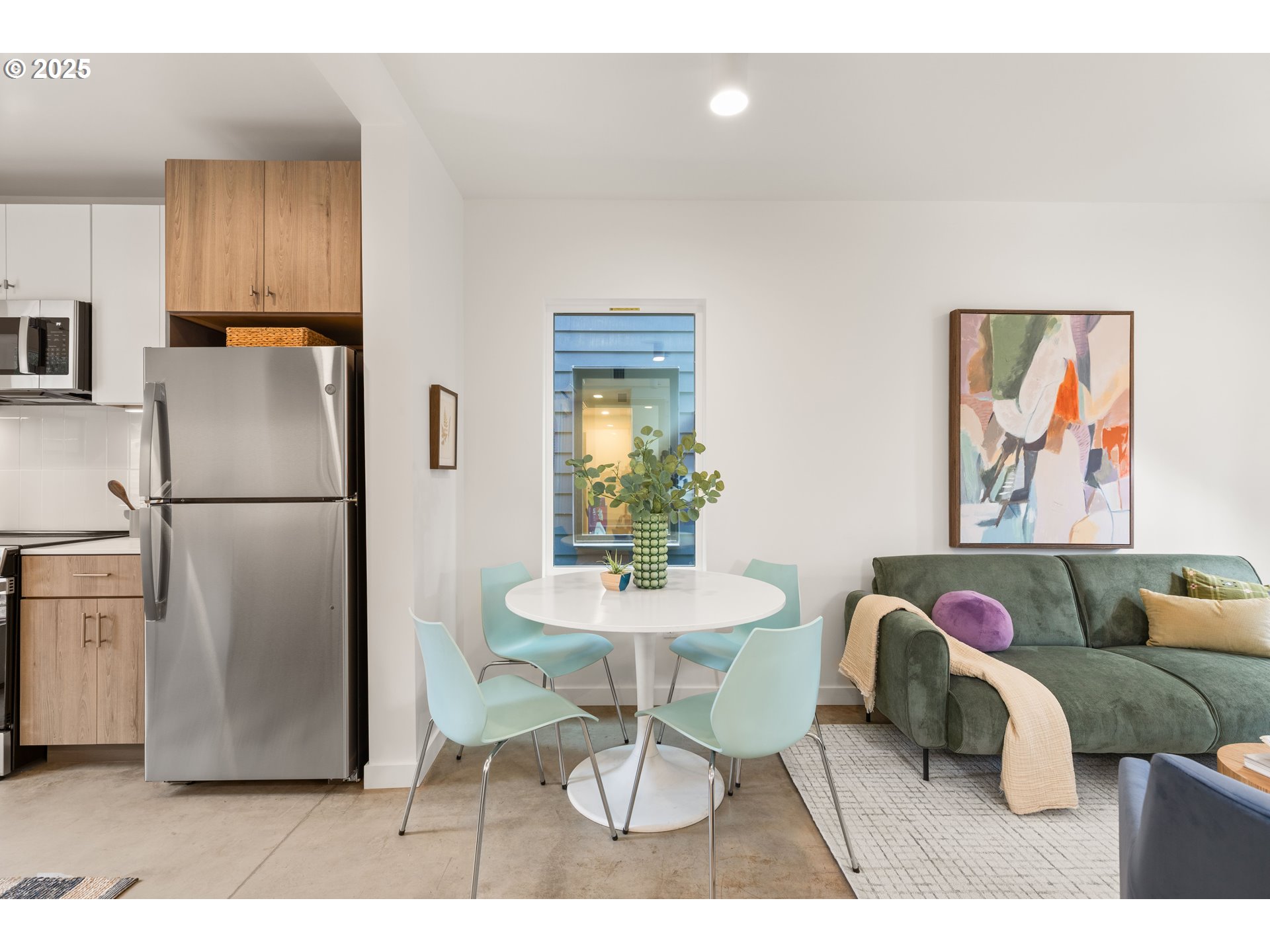 3732 Southeast Harvey Street, Unit 2 Milwaukie, OR 97222 - Photo 5 of 32 a view of kitchen with stainless steel appliances granite countertop a refrigerator and a dining table