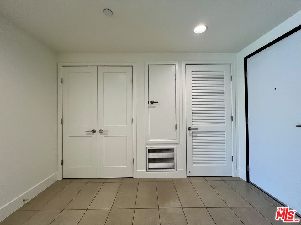11715 Bellagio Road, Unit 204 Los Angeles, CA 90049 - Photo 15 of 27 a view of an empty room