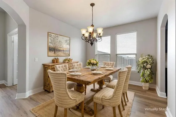 a view of a dining room with furniture and window