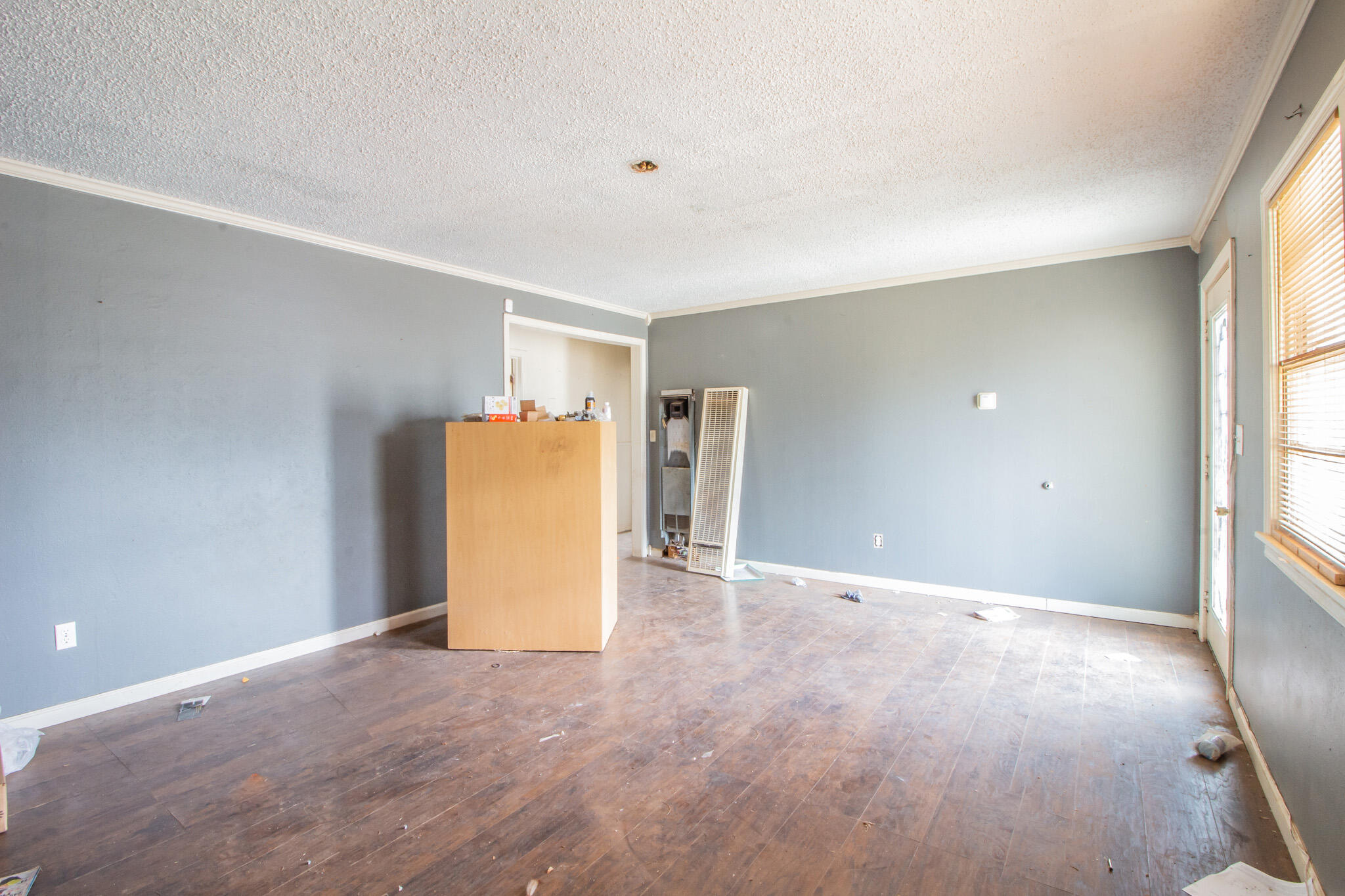 1606 60th Street Lubbock, TX 79412 - Photo 3 of 12 a view of an empty room with a window