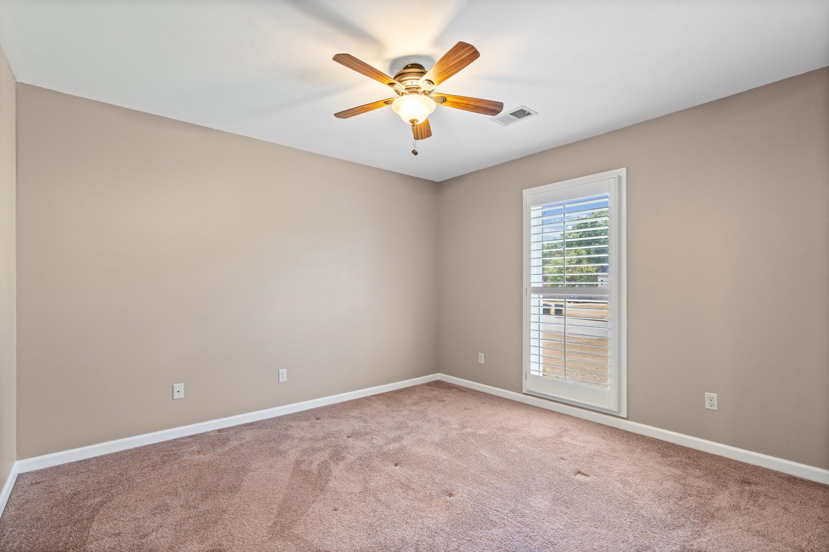 304 Spring Mill Road Collierville, TN 38017 - Photo 20 of 32 Room featuring neutral wall paint, carpet flooring, a ceiling fan with integrated lighting, and a window with white louvered blinds