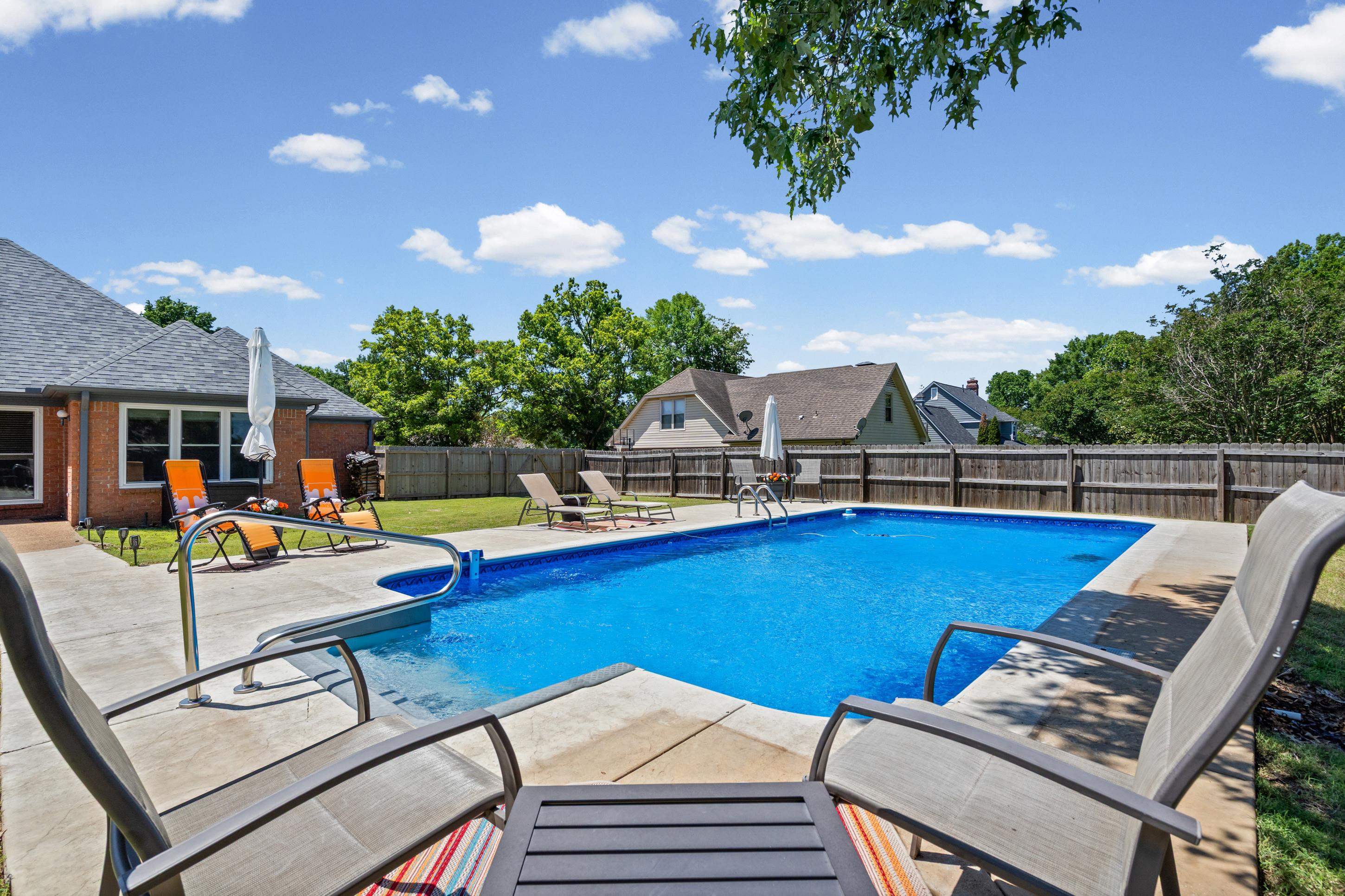 304 Spring Mill Road Collierville, TN 38017 - Photo 26 of 32 Expansive backyard featuring a rectangular in-ground swimming pool with concrete surround