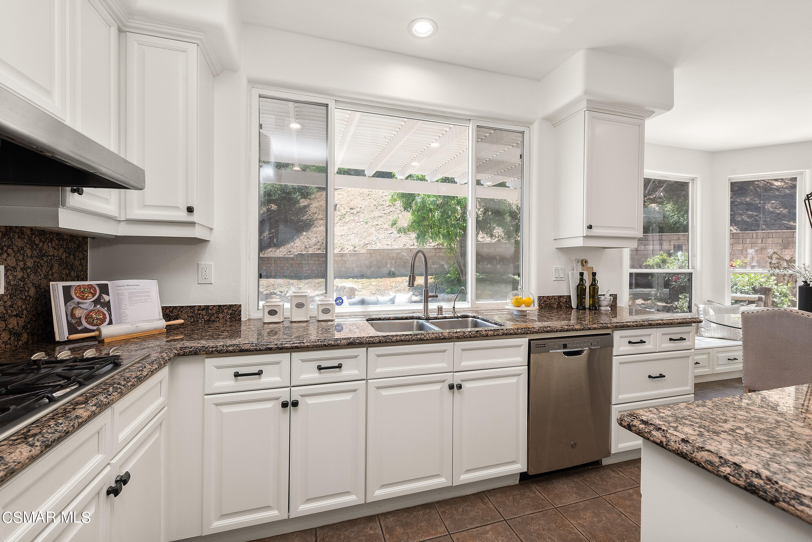 3877 Marks Road Agoura Hills, CA 91301 - Photo 11 of 53 a kitchen with granite countertop a sink stove top oven and cabinets