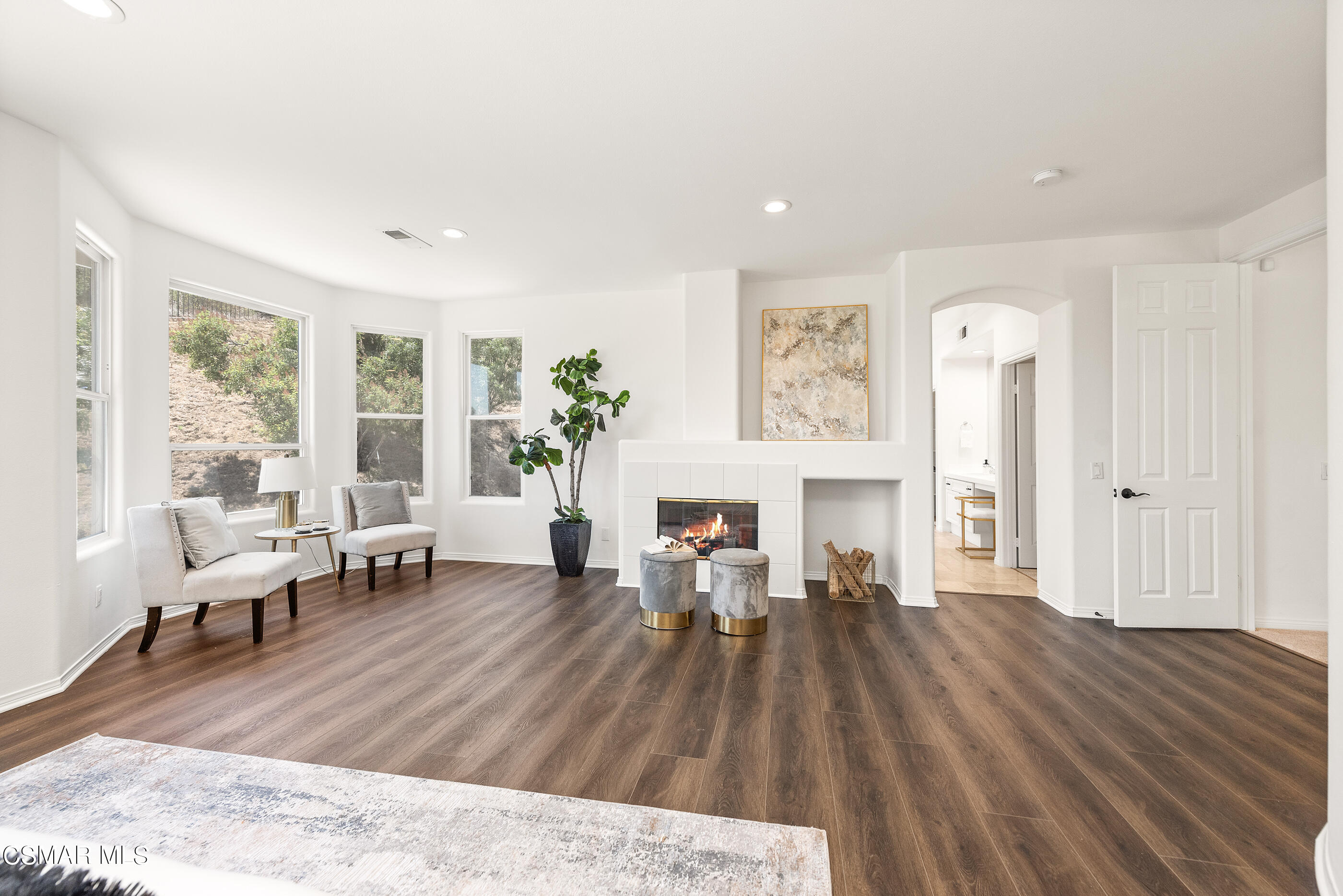 3877 Marks Road Agoura Hills, CA 91301 - Photo 24 of 53 a living room with furniture and a fireplace