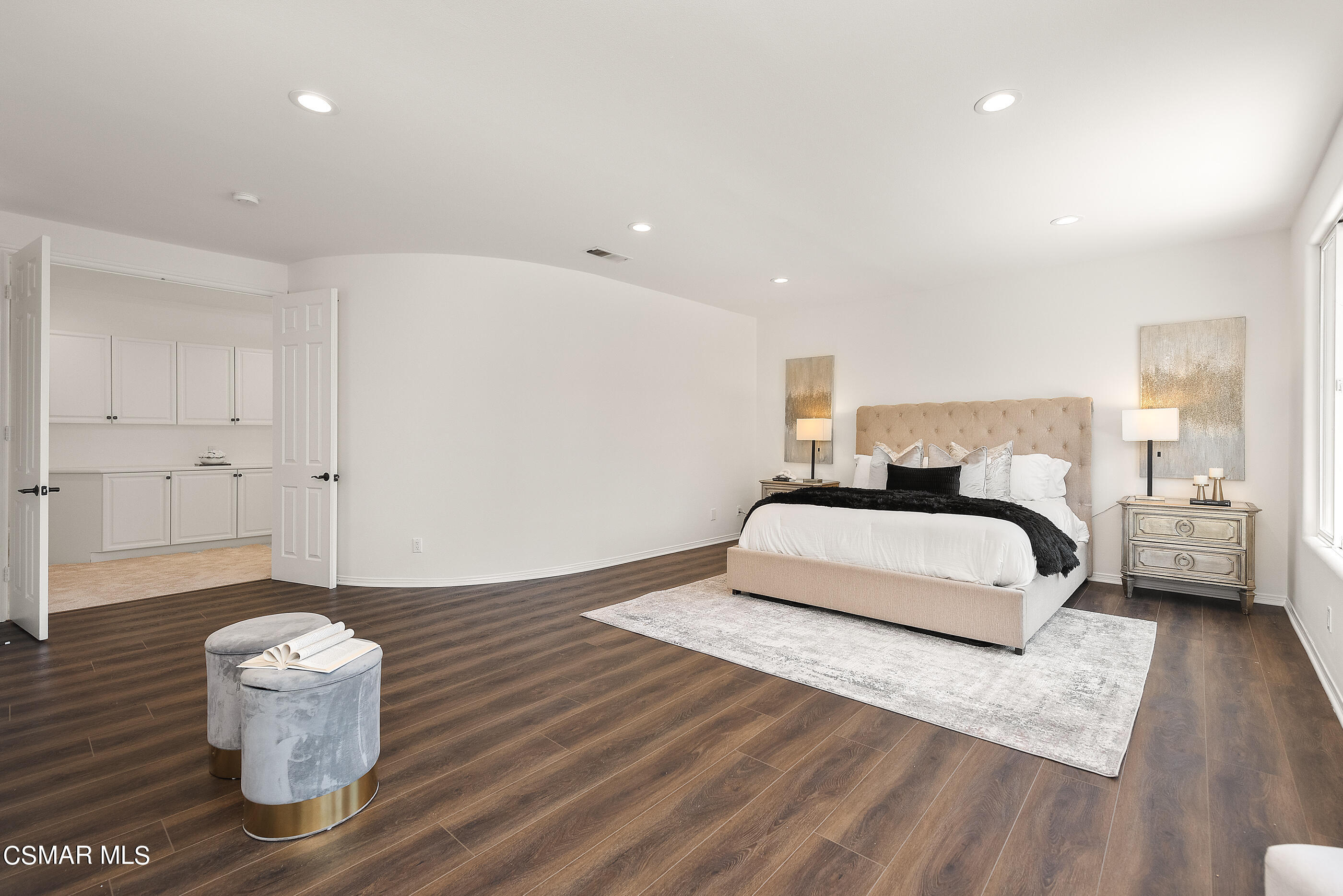 3877 Marks Road Agoura Hills, CA 91301 - Photo 25 of 53 a spacious bedroom with a bed and a table