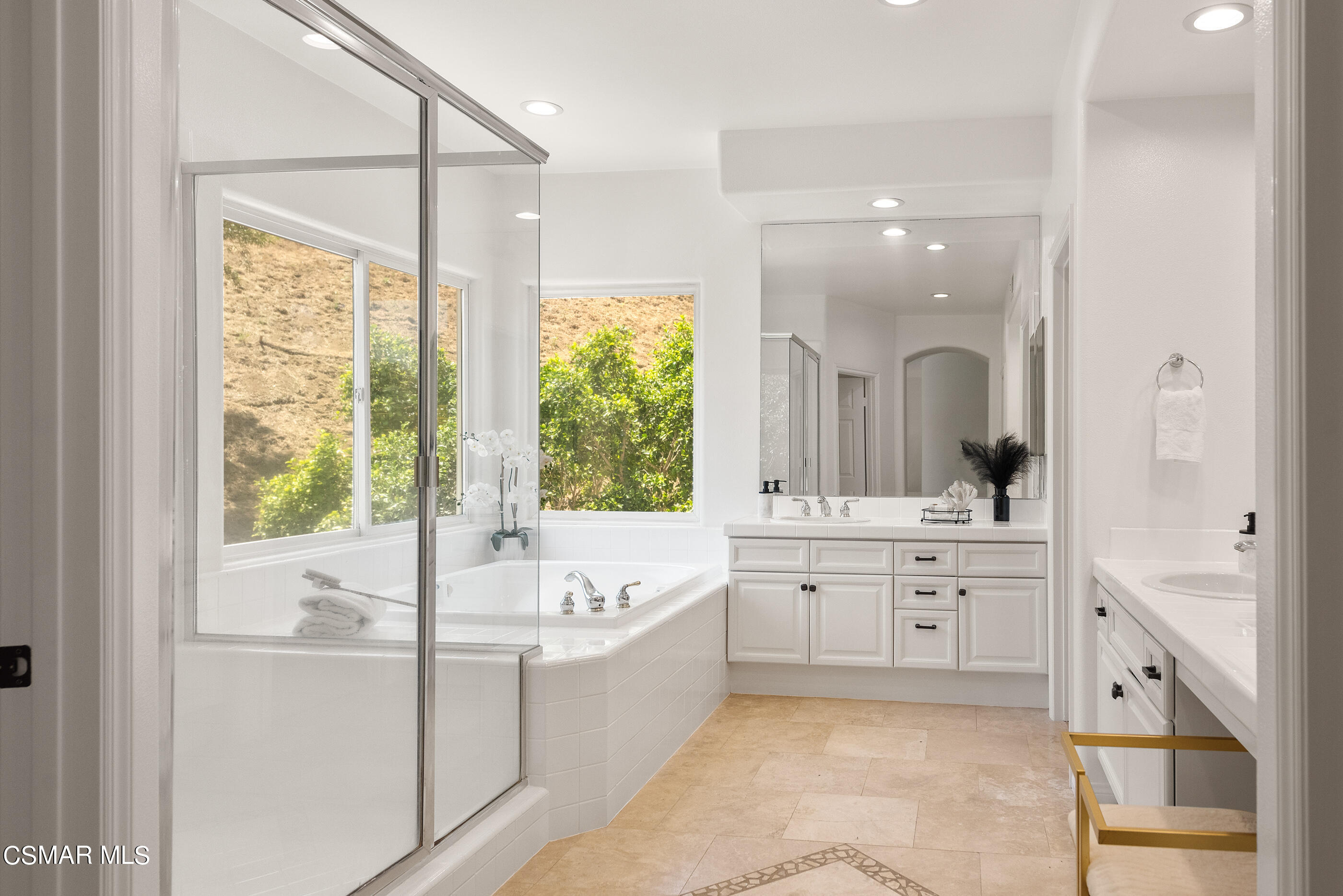 3877 Marks Road Agoura Hills, CA 91301 - Photo 27 of 53 a large bathroom with a large tub sink shower and mirror