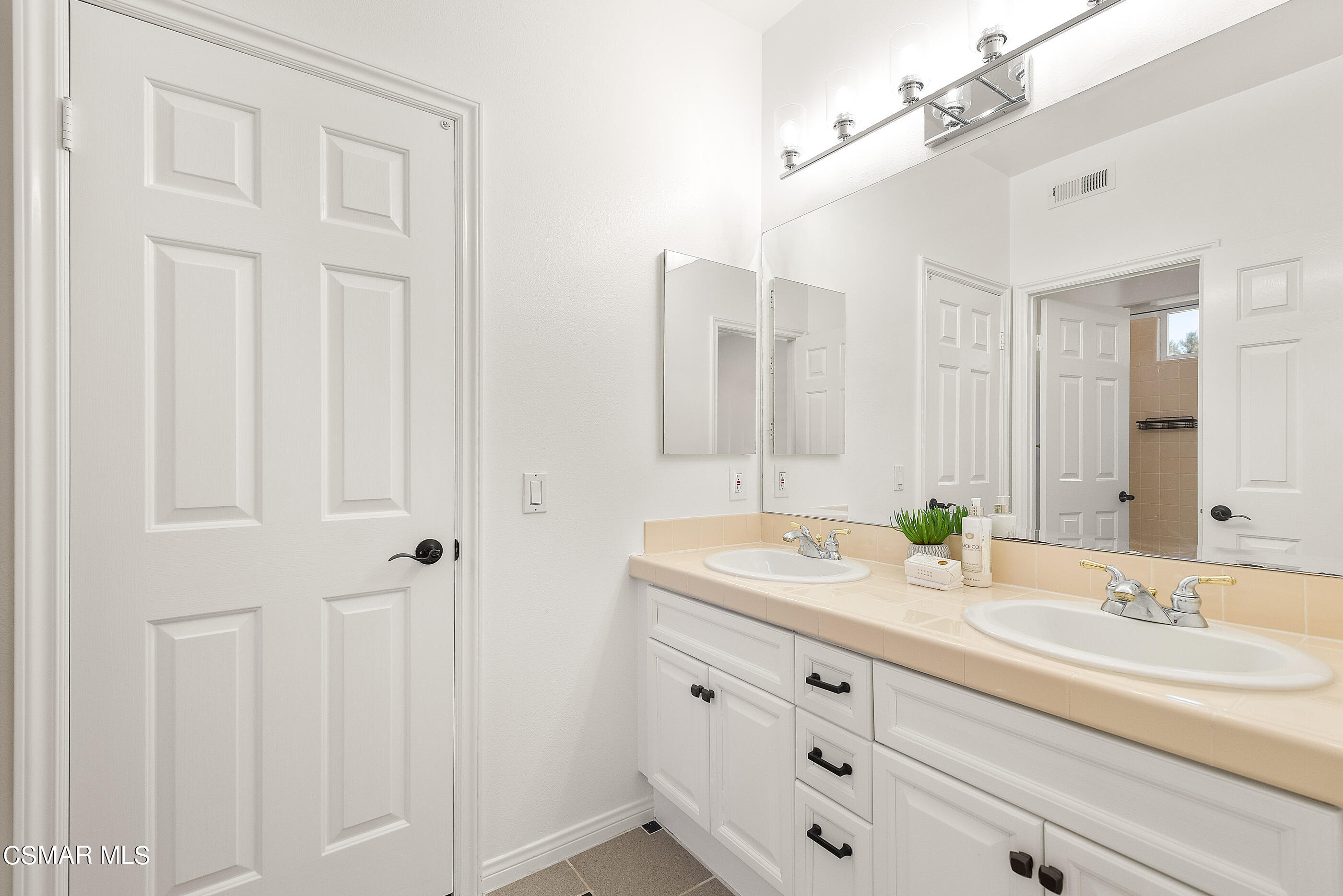 3877 Marks Road Agoura Hills, CA 91301 - Photo 33 of 53 a bathroom with a granite countertop sink and a mirror