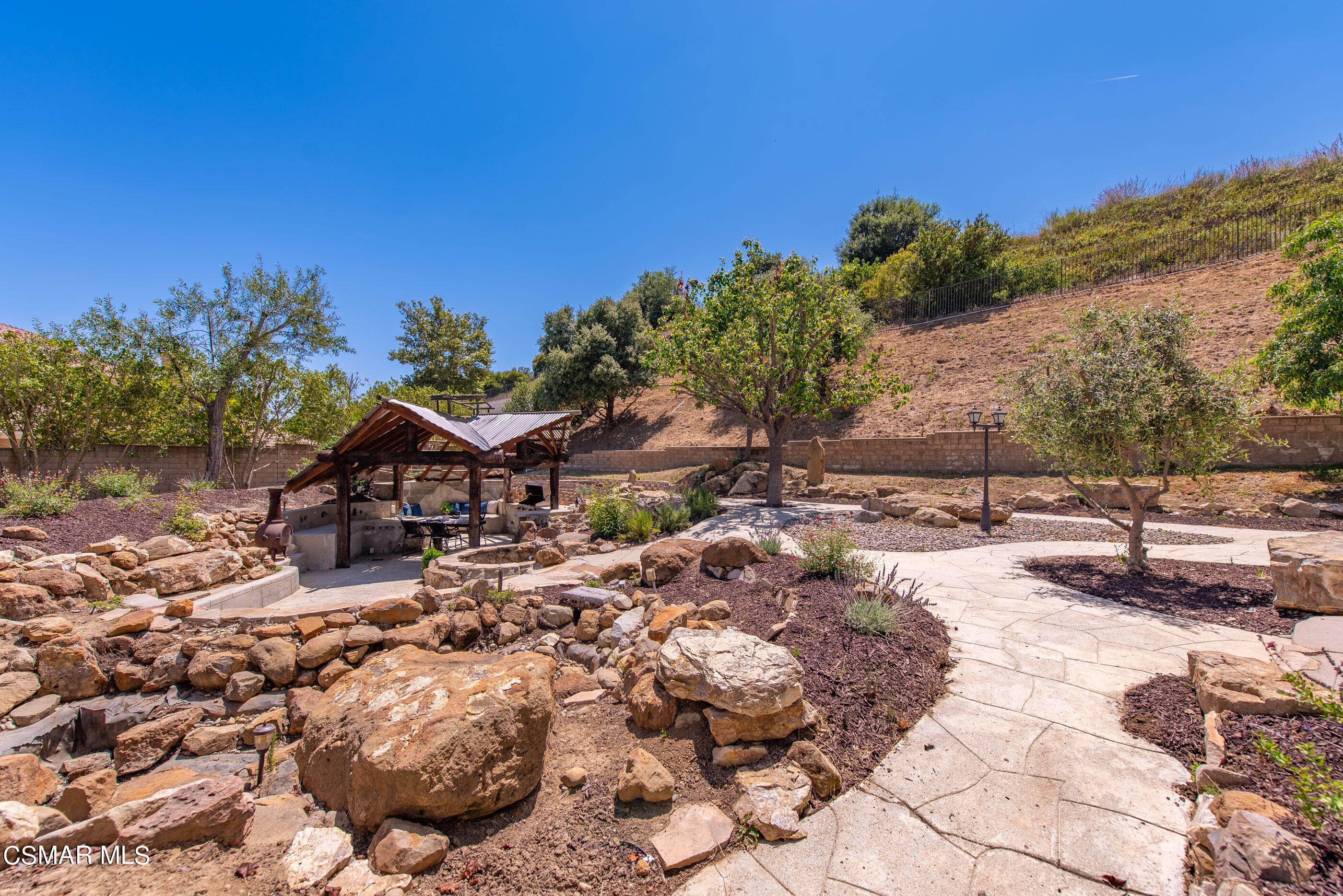 3877 Marks Road Agoura Hills, CA 91301 - Photo 39 of 53 a view of a house with a yard