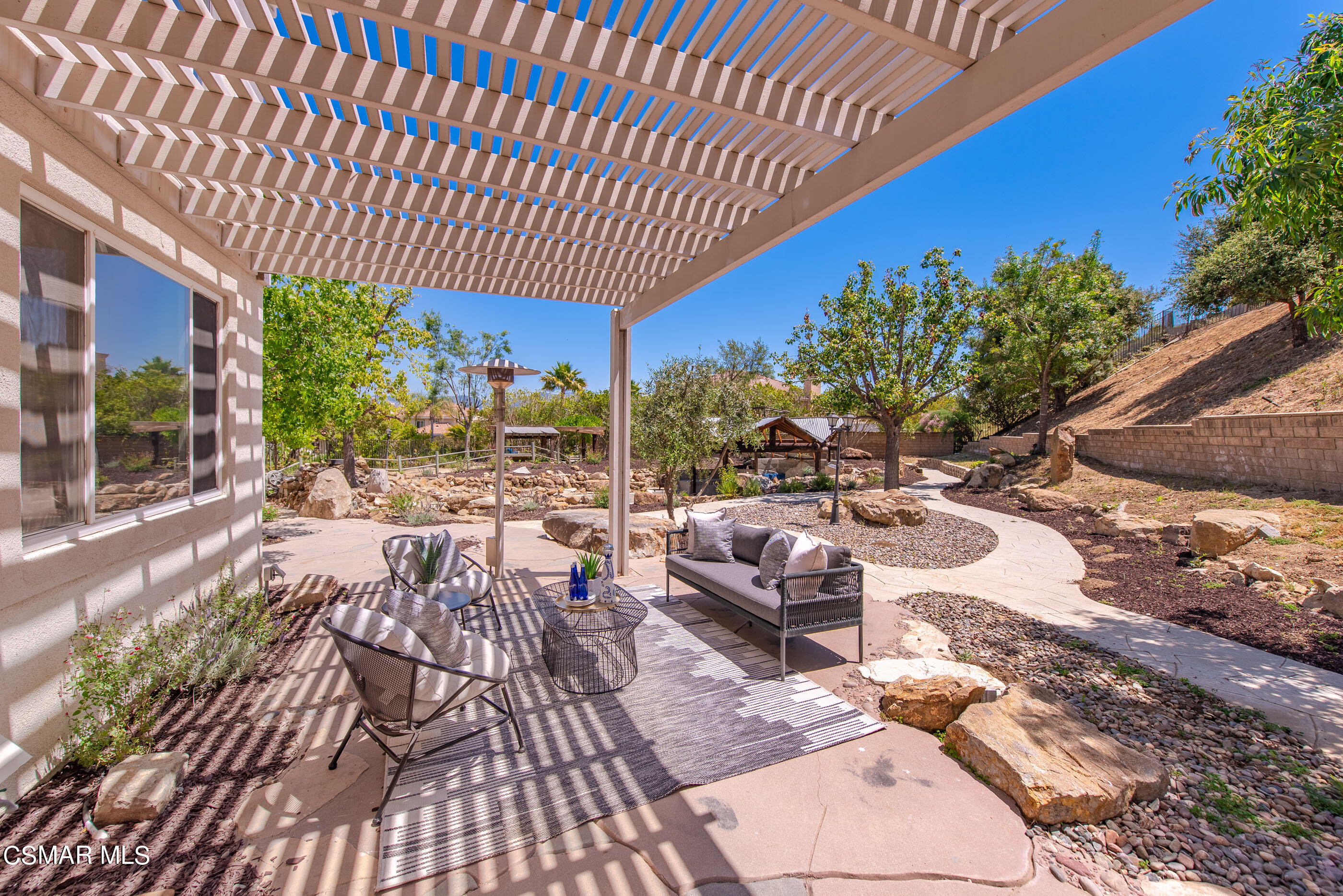 3877 Marks Road Agoura Hills, CA 91301 - Photo 43 of 53 a view of a patio with table and chairs with wooden floor and fence