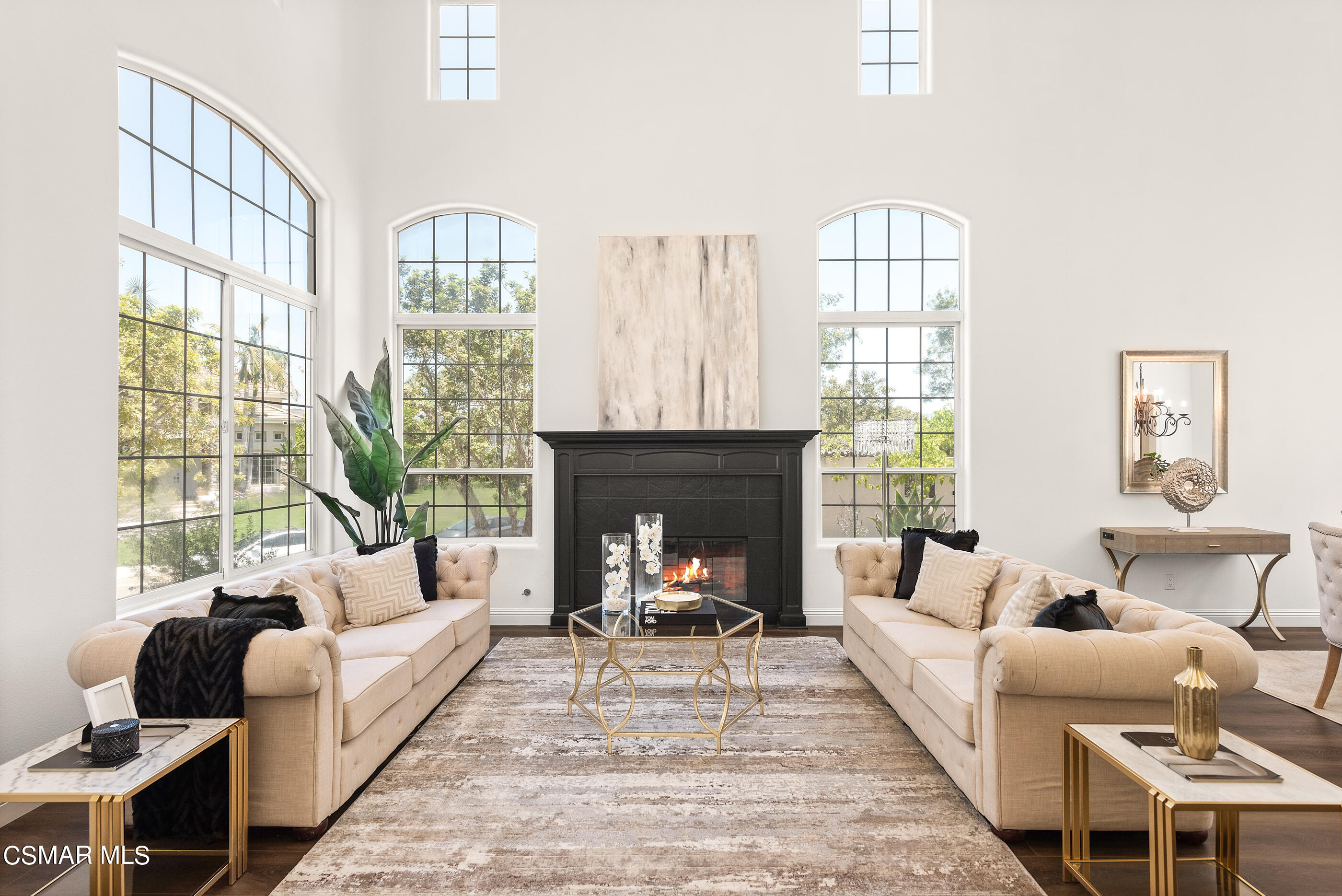 3877 Marks Road Agoura Hills, CA 91301 - Photo 6 of 53 a living room with furniture fireplace and a large window