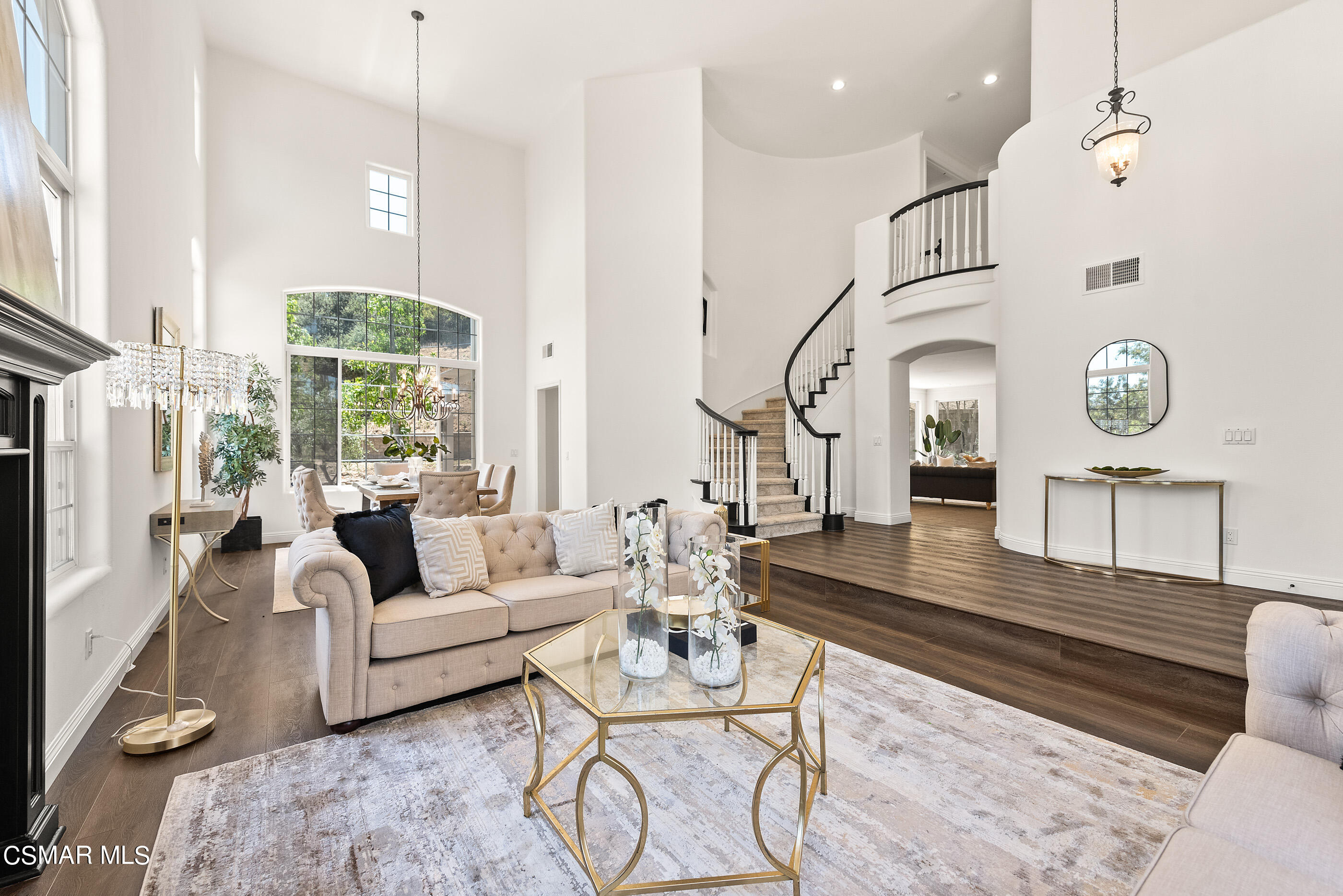3877 Marks Road Agoura Hills, CA 91301 - Photo 7 of 53 a living room with couches chairs and kitchen view with wooden floor