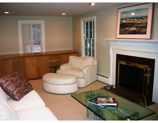 32 Avalon Road Needham, MA 02492 - Photo 2 of 8 a living room with furniture and a fireplace