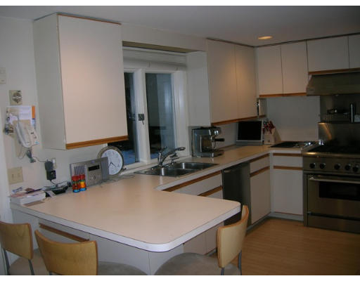 32 Avalon Road Needham, MA 02492 - Photo 4 of 8 a kitchen with kitchen island a sink stove and refrigerator