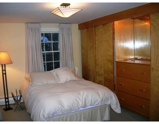 32 Avalon Road Needham, MA 02492 - Photo 5 of 8 a bedroom with a bed and a lamp