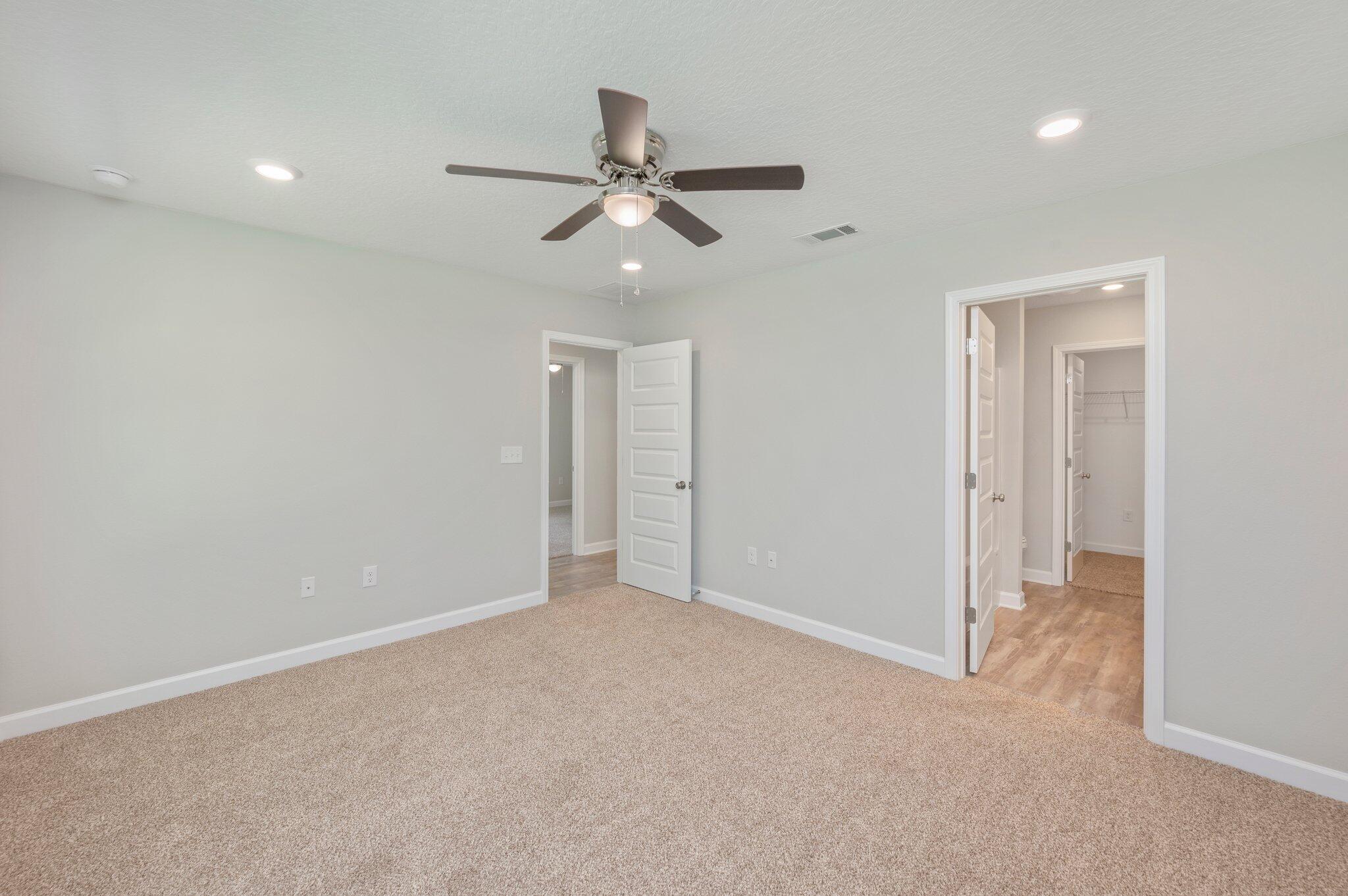 3158 Chestnut Street Crestview, FL 32539 - Photo 15 of 26 an empty room with windows and fan